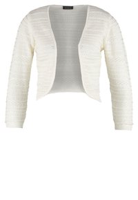 Boléro blanc à ouverture sur le devant, tricoté, avec manches longues et motifs horizontaux texturés sur toute la surface.