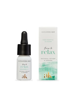 Dropper bottle of essential oil, matte white, black dropper top. Accompanied by a white box with green and gold accents, labeled "time to relax."