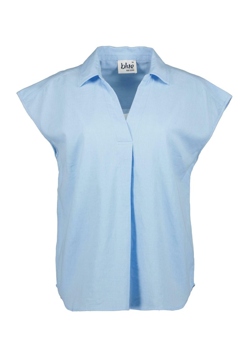 Blusa corta azzurrina a maniche corte con colletto, dotata di una scollatura a V e vestibilità leggermente ampia. Realizzata in tessuto traspirante.