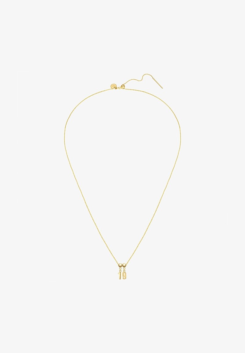 Aukso grandinėlė su delikatesniu dizainu, turinti pakabuką su skaičiais "1" ir "9". Grandinė turi smulkų, tekstūruotą paviršių.