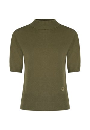 Haut en tricot à manches courtes de couleur vert olive avec col montant et ourlet côtelé, arborant un petit patch logo rond près du bord inférieur.