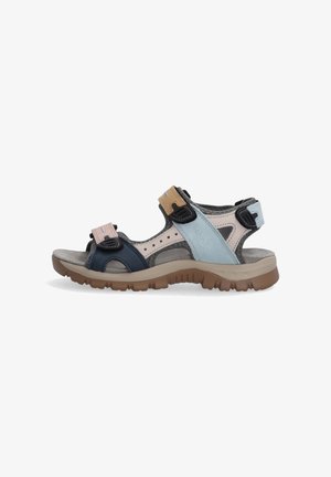 Outdoor sport sandal with adjustable tan, blue, and pink straps, cushioned footbed, and rugged brown sole, shown in side view.