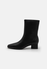 CLAUDIA - Botas clássicas de cano curto - schwarz .