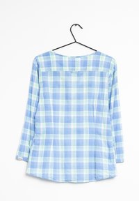Camicia a maniche lunghe in plaid, nei toni del blu chiaro, verde e bianco. Presenta un collo rotondo e spacchi laterali all'orlo. Tessuto di cotone, leggero.