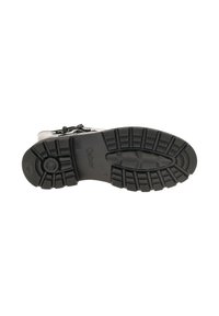 Zwarte rubberen zool met een gestructureerde grip, met een gebogen ontwerp en een merkaccent. Het bovenmateriaal is niet zichtbaar in dit beeld.