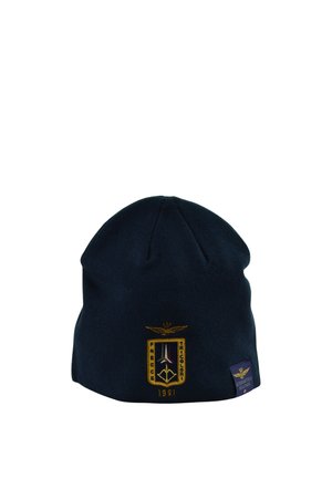 Berretto in maglia blu scuro con logo ricamato giallo e bianco Frecce Tricolori 1961 e piccola etichetta Aeronautica Militare.