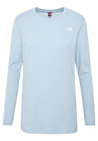 Vaaleansininen pitkähiha-paita pehmeästä kankaasta. Ominaisuuksina pyöreä kaula-aukko ja pieni valkoinen logo vasemmassa rinnassa. Suora helma.