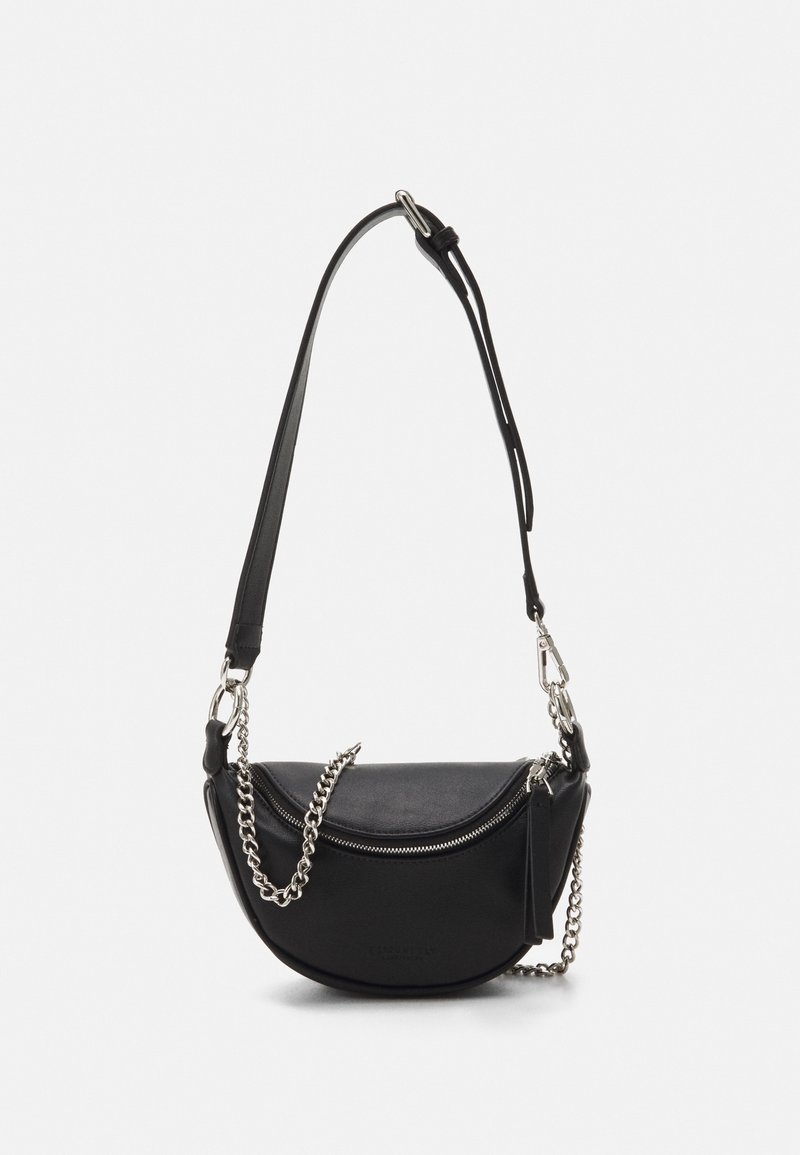 Black leather crossbody bag with a semi-circular shape, featuring a silver chain accent, zipper closure, and an adjustable strap.