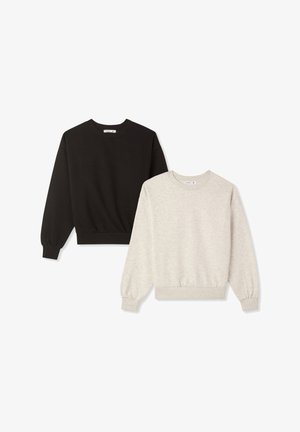 Due felpe girocollo semplici, una nera e una beige, esposte piatte su uno sfondo bianco.