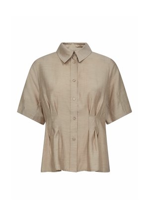 Short-sleeve, collared shirt in light beige fabric. Features button closure and subtle pleats on the front for added texture and shape.
