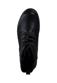 Bottine noire en cuir lisse. Présente un bout arrondi, un système de laçage et une fermeture éclair sur le côté. L'intérieur est doté d'un rembourrage doux pour plus de confort.