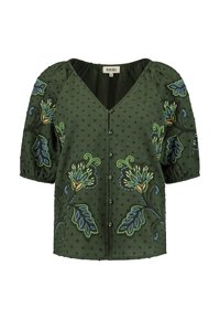 Blouse verte brodée avec des manches bouffantes, présentant des motifs floraux en bleu, vert et orange sur un tissu à pois texturé. Conception en V.