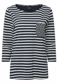 Top a maniche lunghe a righe in blu navy e crema, con una tasca a pois. Tessuto morbido con scollatura arrotondata.