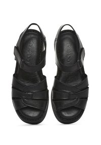 Zwarte leren sandalen met een open teen, uitgerust met kruislings banden en verstelbare enkelbanden. Een gladde textuur en een gevoerde binnenzool.