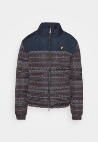 Padded jacket z granatową górną częścią i wzorzystą dolną połową w ciemnych tonach, z geometrycznymi wzorami oraz zapięciem na zamek z przodu.