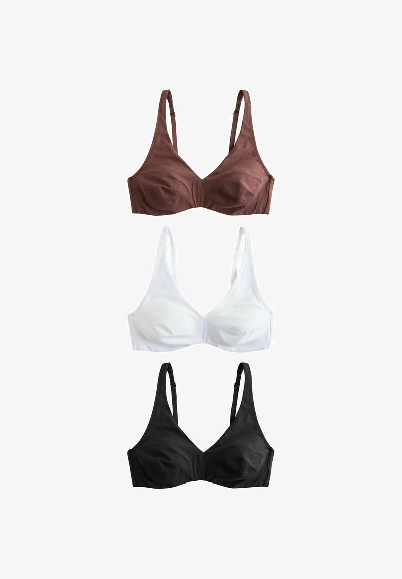 Tre trådløse bh'er i brun, hvid og sort, hver med justerbare stropper, vist på en hvid baggrund.