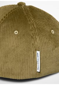 Olive green corduroy cap with ridged texture, featuring a stitched top button and a woven brand label sewn on the side.