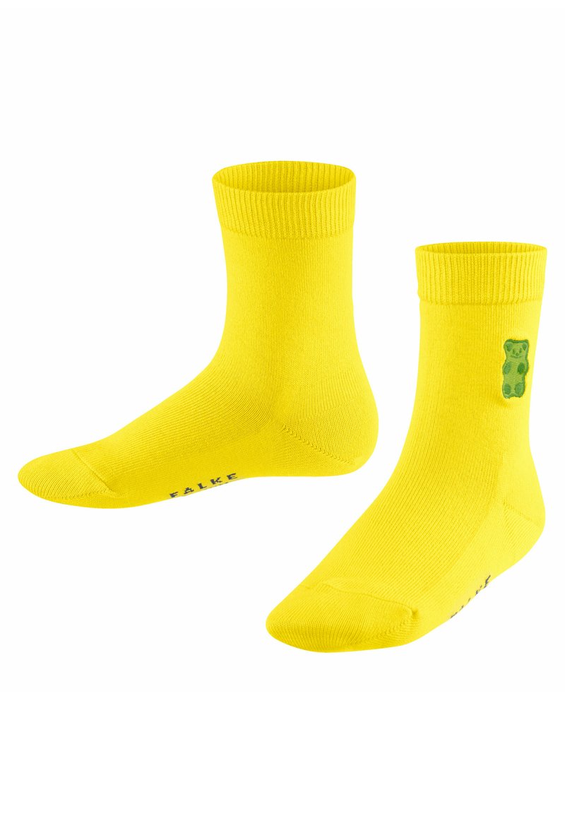 Gelbe Baumwollsocken mit gerippten Bündchen, auf der Seite mit einer grünen Bärengrafik und einem bedruckten Logo an der Unterseite. Mittellange Ausführung bis zur Wade.