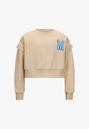 Korte beige sweatshirt met een blauwe geborduurde letter "M" op de borst, ribbelmanchetten en opgerolde mouwen. Zachte stoftextuur.