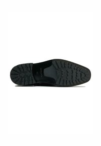 Black leather shoe sole featuring a textured rubber grip pattern with ridges and cleats for traction. Size marked as 42.