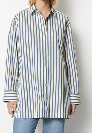 Chemise à rayures en crème clair et bleu marine, dotée d'un col classique, de manches longues et de poignets avec des détails rayés assortis.