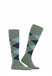 Calze al ginocchio in verde tenue con un motivo a rombi in blu chiaro e blu navy. Texture liscia con un bordo a costine per una vestibilità sicura.