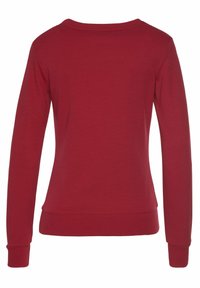 Roter Langarm-Sweatshirt mit Rundhalsausschnitt, aus weichem Material, mit gerippten Bündchen und glatter Textur. Schlichte Rückseitengestaltung.