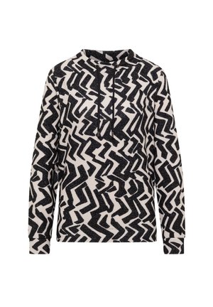 Bluza z kapturem w czarno-białym wzorze zygzaka. Posiada sznurek przy kołnierzy oraz długie rękawy wykonane z teksturowanej tkaniny.