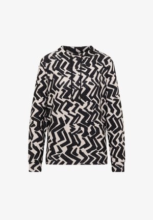 Pullover hoodie med et sort og hvidt zigzag-mønster. Har en snoretræk ved halsen og lange ærmer lavet af et tekstureret stof.
