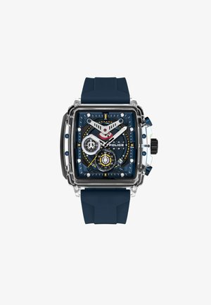 Quadratische Uhr mit transparentem Gehäuse, blauer Zifferblatt, roten und gelben Akzenten sowie einem navyblauen Silikonarmband. Verfügt über mehrere Unterzifferblätter und große Stundenmarkierungen.