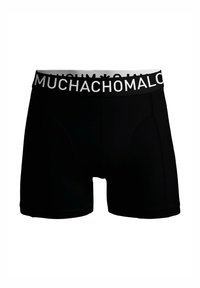 Črne boxer hlačke z mehkimi elastičnimi pasom, ki prikazuje napis "MUCHACHO MALO" v belem tisku. Imajo prileganje in gladko teksturo.