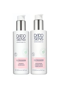 Two white bottles with pump caps, labeled "EXTRODERM" in blue text. One is shampoo, the other is shower cream, both 200 ml. Pink accents.