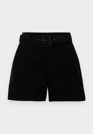 Shorts de pana negros de cintura alta con un cinturón de tela a juego y hebilla rectangular sobre un fondo blanco.