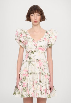 Floral dress with ruffled sleeves, featuring a v-neckline, tiered fabric, and a white background with pink and green botanical patterns.