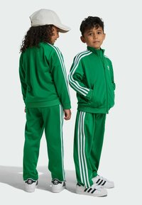 adidas Originals FIREBIRD UNISEX  - Verryttelyhousut - green