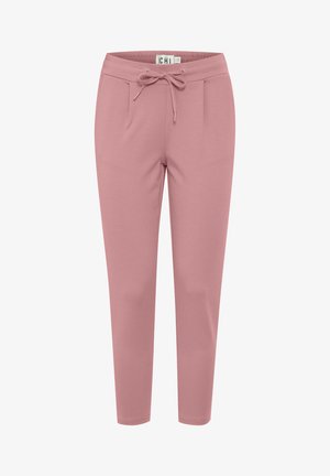 Ružové jogger nohavice z mäkkého materiálu s pásom na šnúrku, elastickými manžetami a dvoma bočnými vreckami. Hladký povrch bez vzorov.