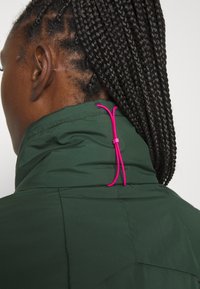 asics running rain jacket