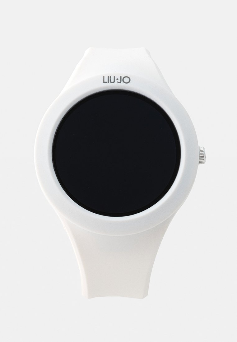 Montre-bracelet en silicone blanc avec un cadran rond noir, présentant un logo en haut et une couronne argentée sur le côté. Texture lisse.
