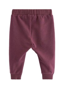 Bordeaux sweatpants lavet af blødt bomuldsstof, med elastisk talje og ribbede manchetter, i en afslappet pasform med indsnit på benene.