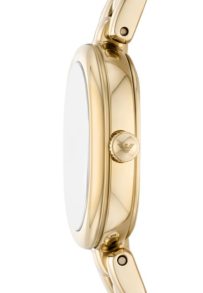 Side view of a gold-toned wristwatch with a round case, a crown engraved with a logo, and attached metal link strap.
