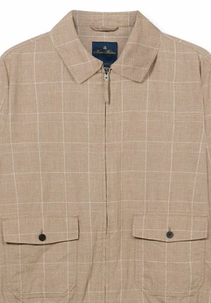 Giacca a camicia beige con chiusura a zip, motivo a quadri bianco sottile, colletto appuntito e due tasche frontali con patta e bottoni scuri.