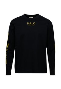 Svart långärmad skjorta med gul text på framsidan och ärmarna, tillverkad av mjukt material med rundad halsringning och avslappnad passform.