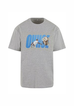 Szürke pamut póló, nagyméretű kék grafikával, amely egy embert és egy baglyot ábrázol. Kerek nyakú és rövid ujjú. Normál fazon.