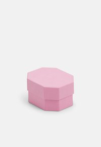 Hexagonal pink box with a textured finish, featuring a subtle embossed logo on the lid and a flat base for stability.