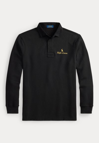 Svart langermet polo-skjorte laget av bomull. Har krage, knappelukking og et gullbrodert "Ralph Lauren"-logo med en ponysymbol.