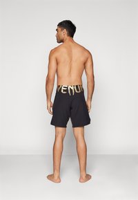 Venum RAPID FIGHTSHORTS - Sports shorts - black/gold