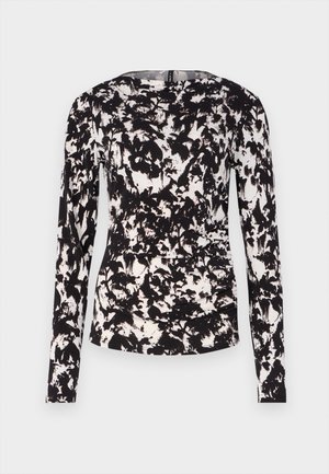 Črno-bela majica z dolgimi rokavi z teksturiranim, abstraktnim cvetličnim vzorcem. Ima okroglo ovratnico in prilegajočo se silhueto.