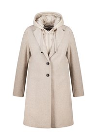 Beige wollen jas met een getailleerde pasvorm, voorzien van een afneembaar gewatteerd vest met capuchon, twee knopen en lange mouwen.