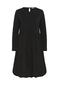 Crna haljina s dugim rukavima, okruglim izrezom i prilagođenim korzetom. Suknja je bujna, izrađena od teksturiranog materijala, s detaljem u obliku ključanice na leđima.