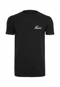 Svart bomull T-skjorte med korte ermer, med en hvit "Miami" logo og et grønt palmetre-design på venstre brystområde.